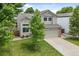 Charming two-story home with a well-maintained lawn and a two-car garage, perfect for Gathering living at 11188 Latigo Ln, Parker, CO 80138