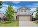 Charming two-story home with a well-maintained lawn and a two-car garage, perfect for Gathering living at 11188 Latigo Ln, Parker, CO 80138