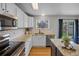 Stylish kitchen with granite countertops, stainless steel appliances, and a view of the backyard through a window at 11188 Latigo Ln, Parker, CO 80138