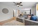 Comfortable living room area with hardwood flooring and stylish décor that leads into the open kitchen at 11188 Latigo Ln, Parker, CO 80138