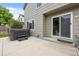 Back patio featuring a hot tub with steps and a sliding glass door entrance to the home at 11188 Latigo Ln, Parker, CO 80138