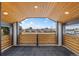 Relaxing balcony with wooden ceiling and a cityscape view in the distance at 1578 Lowell Blvd # 1, Denver, CO 80204