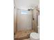 Modern bathroom includes a glass enclosed shower with tiled walls and rainfall shower head at 1578 Lowell Blvd # 1, Denver, CO 80204