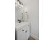Modern bathroom featuring a white vanity with black hardware and a unique light fixture at 1578 Lowell Blvd # 1, Denver, CO 80204