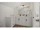 Bright bathroom features double sinks, modern fixtures, and a large mirror at 1578 Lowell Blvd # 1, Denver, CO 80204