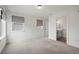 Bright bedroom with neutral carpet and an en-suite bathroom at 1578 Lowell Blvd # 1, Denver, CO 80204