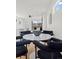 Modern dining area with black chairs, white walls and a large sliding door at 1578 Lowell Blvd # 1, Denver, CO 80204