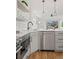 Modern kitchen features stainless appliances and a sleek quartz countertop island at 1578 Lowell Blvd # 1, Denver, CO 80204