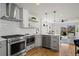 Bright kitchen with stainless steel appliances and an open floorplan at 1578 Lowell Blvd # 1, Denver, CO 80204
