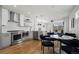 Open concept kitchen with stainless steel appliances and a modern dining area at 1578 Lowell Blvd # 1, Denver, CO 80204