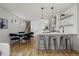 Modern kitchen with stainless steel appliances, breakfast bar, and open layout for entertaining at 1578 Lowell Blvd # 1, Denver, CO 80204