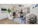 Inviting living room featuring a fireplace, hardwood floors, modern furnishings, and an open floor plan at 1578 Lowell Blvd # 1, Denver, CO 80204