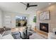 Bright living room featuring a fireplace, sleek furniture, and plenty of natural light at 1578 Lowell Blvd # 1, Denver, CO 80204