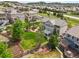 Aerial shot of a home with a landscaped yard, a back patio, fire pit, and neighborhood views at 2090 Bellavista St, Castle Rock, CO 80109