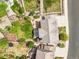 Aerial view of home, showcases backyard with a patio, pergola, fire pit, garden, and play area at 2090 Bellavista St, Castle Rock, CO 80109