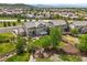 Spacious backyard features a patio, pergola, lush lawn, garden beds, and play area at 2090 Bellavista St, Castle Rock, CO 80109