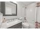 Stylish bathroom featuring a marble countertop vanity, shower, and modern fixtures at 2090 Bellavista St, Castle Rock, CO 80109