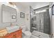 Bathroom with a walk-in shower, tile surround, modern fixtures and sink at 2090 Bellavista St, Castle Rock, CO 80109
