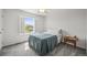 Inviting bedroom featuring a plush bed, natural light from a window, and a stylish side table at 2090 Bellavista St, Castle Rock, CO 80109