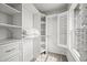 Well-organized walk-in closet featuring custom shelves, drawers, and ample storage for organized living at 2090 Bellavista St, Castle Rock, CO 80109