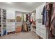 Spacious walk-in closet provides ample storage with custom shelving and cabinets for organized living at 2090 Bellavista St, Castle Rock, CO 80109