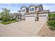 Charming home featuring a three-car garage and a spacious driveway in a lovely neighborhood at 2090 Bellavista St, Castle Rock, CO 80109