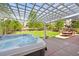 Backyard hot tub under a pergola, with an outdoor dining set and beautiful landscaping at 2090 Bellavista St, Castle Rock, CO 80109