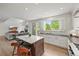 Open concept kitchen with stainless steel appliances, a center island, and a view to the living room at 2090 Bellavista St, Castle Rock, CO 80109