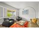 Cozy living room with large windows, comfortable seating, and stylish decor, creating a welcoming atmosphere at 2090 Bellavista St, Castle Rock, CO 80109