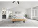 Spacious main bedroom with a vaulted ceiling, large bed, bench, and bright windows at 2090 Bellavista St, Castle Rock, CO 80109
