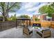 Backyard featuring a gazebo, fire pit, outdoor furniture, and a paved patio at 11651 Pennsylvania St, Northglenn, CO 80233