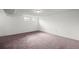 Spacious carpeted basement with two windows providing ample natural light at 11651 Pennsylvania St, Northglenn, CO 80233