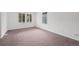 Bright bedroom with large windows offering plenty of natural light and neutral carpeting at 11651 Pennsylvania St, Northglenn, CO 80233