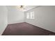 Bedroom with neutral carpet, ceiling fan, and bright windows at 11651 Pennsylvania St, Northglenn, CO 80233