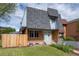 Charming two-story home featuring a well-manicured lawn and a classic brick facade at 11651 Pennsylvania St, Northglenn, CO 80233