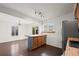 Well-lit kitchen featuring an island with wood countertops and stainless steel appliances at 11651 Pennsylvania St, Northglenn, CO 80233