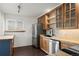 Bright modern kitchen featuring stainless appliances, wood cabinets, and an island at 11651 Pennsylvania St, Northglenn, CO 80233