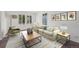 Cozy living room with ample seating, natural light, and stylish decor at 11651 Pennsylvania St, Northglenn, CO 80233