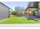 Spacious backyard featuring a covered patio with outdoor seating at 516 Grant Ave, Louisville, CO 80027