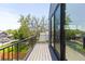 Spacious private balcony with stylish gray flooring and metal railing at 516 Grant Ave, Louisville, CO 80027