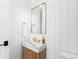 Chic bathroom with white shiplap walls, marble sink, gold faucet, and a modern gold mirror at 516 Grant Ave, Louisville, CO 80027