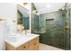 Chic bathroom with a glass-enclosed shower, stylish vanity, and elegant fixtures for a luxurious feel at 516 Grant Ave, Louisville, CO 80027
