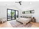 Bright bedroom featuring large sliding glass doors to a private balcony and vaulted ceilings at 516 Grant Ave, Louisville, CO 80027