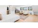 Bright bedroom with a cozy seating area, large windows, and an ensuite bathroom for added convenience at 516 Grant Ave, Louisville, CO 80027