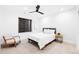 Modern bedroom featuring a ceiling fan, neutral decor, and a comfortable bed with plush pillows at 516 Grant Ave, Louisville, CO 80027