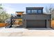 Modern two-story home with a covered deck and a convenient two-car garage and staircase at 516 Grant Ave, Louisville, CO 80027