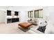 Finished basement with stylish seating area, wet bar, and natural light at 516 Grant Ave, Louisville, CO 80027