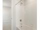 Bathroom with tub and shower in bright light at 9089 Pitkin St, Commerce City, CO 80022