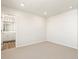 Spacious carpeted bedroom leading to en-suite bathroom at 9089 Pitkin St, Commerce City, CO 80022