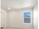 Bedroom featuring neutral walls, carpeted floor, and natural light from a window at 9089 Pitkin St, Commerce City, CO 80022